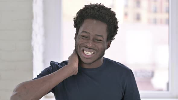 Portrait of Tired Young Man Having Neck Pain