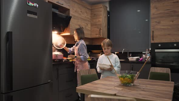 Caucasian Mother and Son Preparing Dinner Together at Home