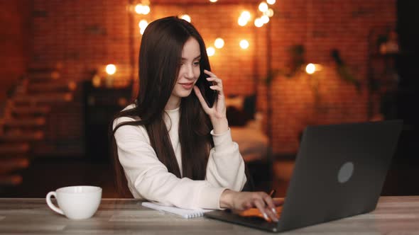 A Woman is Sitting in Her Home Office