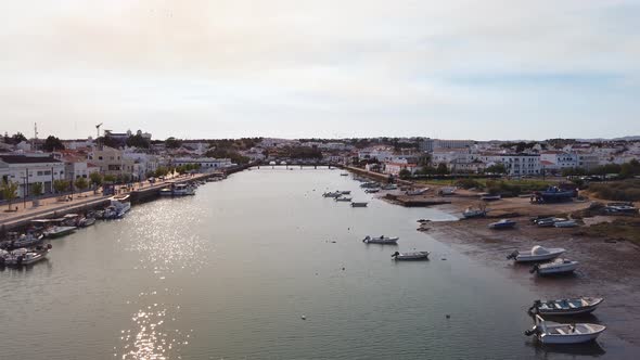 Overlooking Gilao River and Tavira harbor at sunset, Portugal, wide.