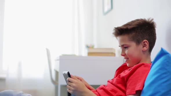 Smiling Boy with Tablet Pc Computer at Home