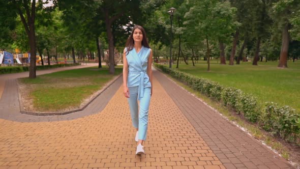 Brunette Walking on the Street Summer Season