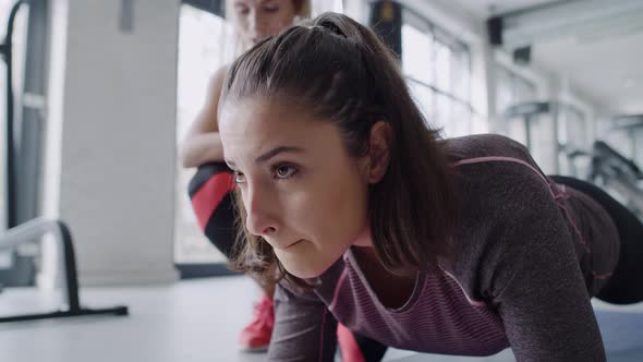 Young woman during hard workout at gym.  Shot with RED helium camera in 8K