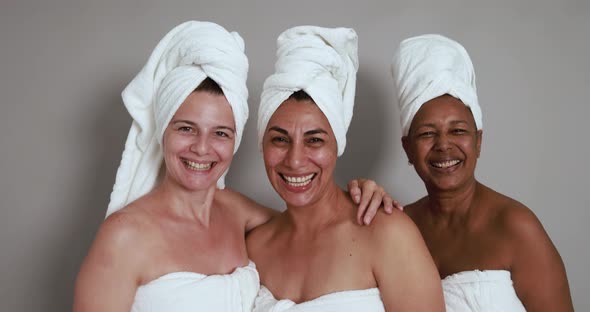 Multiracial senior women enjoy beauty treatment day together