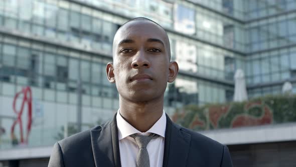 Young African American Businessman Looking at Camera