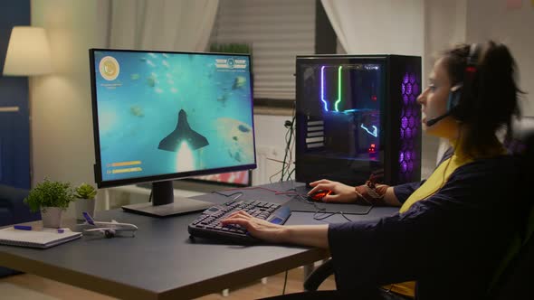 Gamer Playing Online Space Shooter Video Games Using Powerful Computer