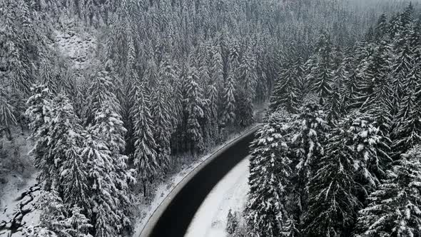 Aerial View of Snowed Winter Road in Carpathian Mountains