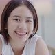 Portrait of smiling Asian girl with natural makeup and healthy smooth skin looking at camera. - VideoHive Item for Sale