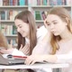Teenage Girl Looking Tired and Bored While Studying at the Library - VideoHive Item for Sale