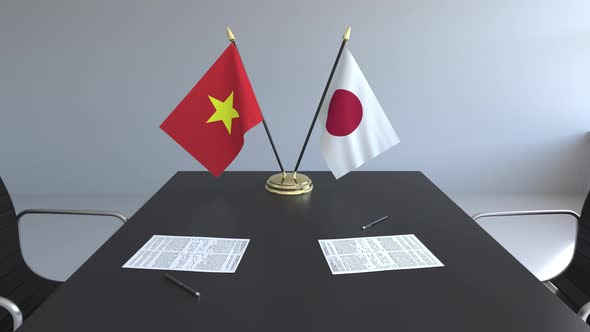 Flags of Vietnam and Japan and Papers