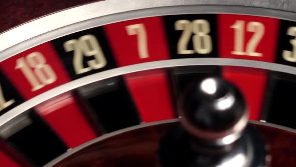 Classic Casino Roulette Spinning, Dealer Takes the White Ball, Close Up