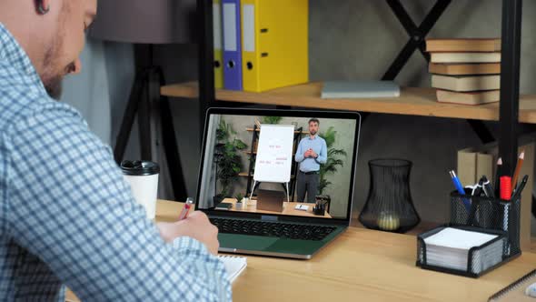 Man Coach in Laptop Screen Stands Near Flip Chart Greets Talk Teaches Student