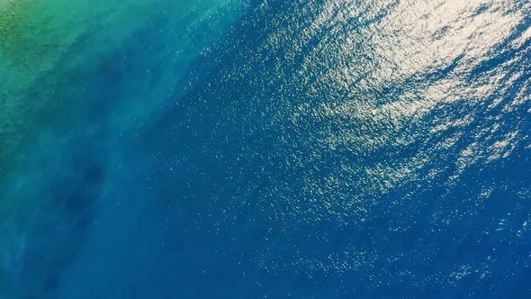 Aero, Top View. The Turquoise Blue Waters of the Aegean in the Sunlight. Coastline.