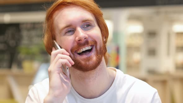 Redhead Beard Man Talking on Phone Attending Phone Call