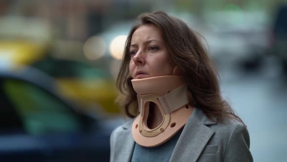 Portrait of Middle-aged Woman with Neck Brace in City, Closeup, Curing and Prevention of