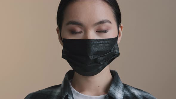 Indoors Portrait Close Facial Expression Female Face Asian Race Woman Ill Serious Girl in Black