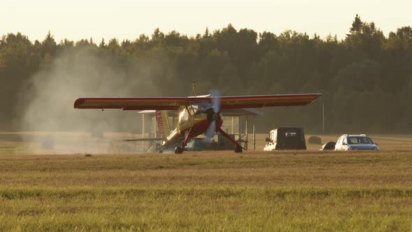 Small Yellow and Red Private Jet Starts Engine Propeller Start Spin There is Lot of Smoke Around