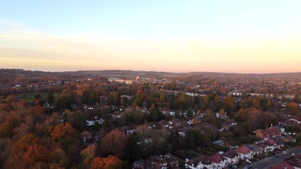 Beautiful aerial shot of a British suburban town in autumn at sunset