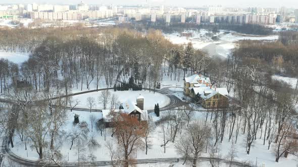 An Island on a Lake with a Bridge in the Winter Loshitsky Park