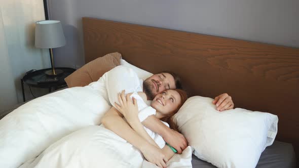 Young Married Couple Sleep Together, Lie on Bed