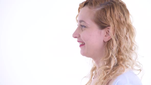 Closeup Profile View of Happy Beautiful Blonde Woman Smiling