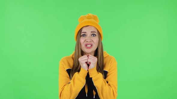 Portrait of Girl Is Looking at Camera with Excitement, Then Celebrating Victory and Showing Thumbs