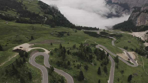 Aerial shot from Drone of green Mountains full of high Trees.