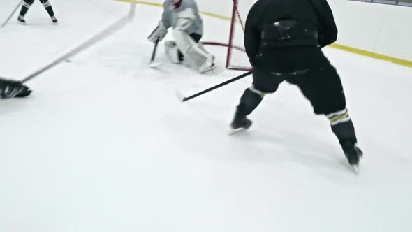 Hockey Players Tricking Goalie and Scoring Goal