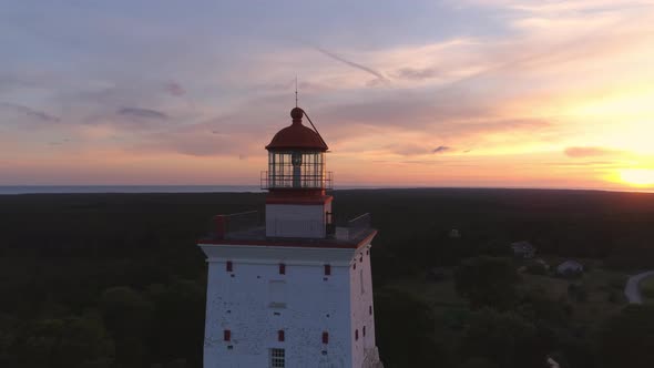 Flying Around Old Lighthouse At Sunset 