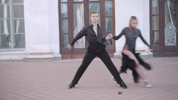 Wide Shot of Confident Couple Performing Paso Doble in Urban City