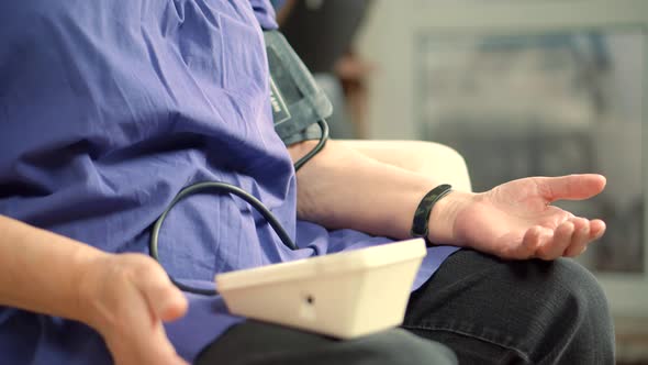 Unhealthy Woman Checking Blood Pressure Hypotension Diagnostic On Medical Tonometer. Measuring Pulse