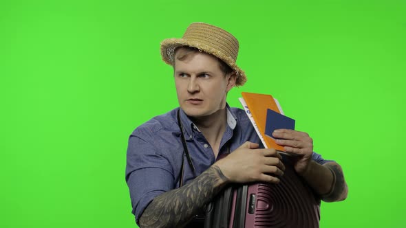 Portrait of Man Tourist with Suitcase, Passport and Tickets. Chroma Key