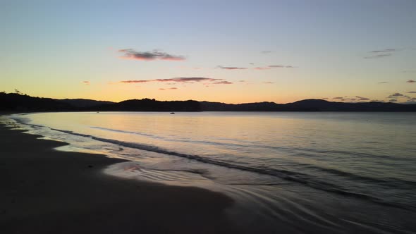 Glass out conditions in Cooks beach at sunset