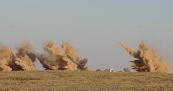 Slow motion of Airstrike with bombs hitting targets with smoke and explosions alt