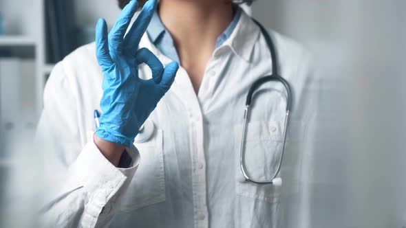 Doctor Medic Shows Gesture Sign All Is Well Ok. The Doctor's Hand Shows A Gesture Of Ok