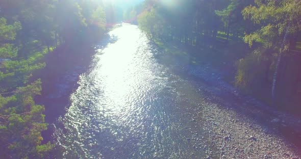 Low Altitude Flight Over Fresh Fast Mountain River with Rocks at Sunny Summer Morning