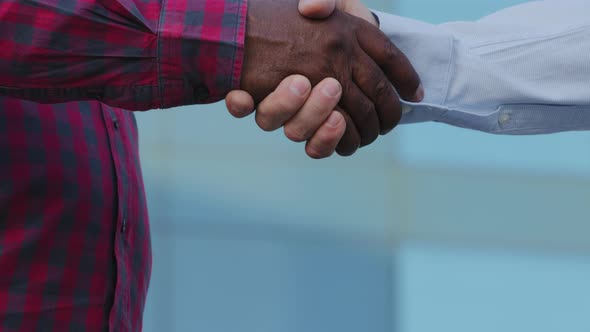 Closeup Part of Human Body Diverse Male Partners Shake Hands Conclude Successful Contract Agreement