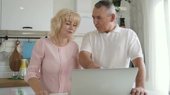 American Man and Woman Talk with Smile, Watch at Monitor in Lighting Room