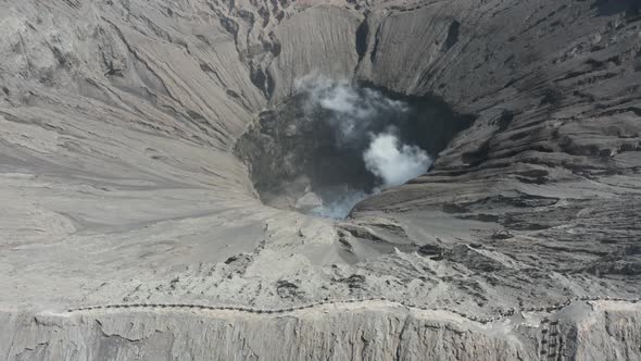Aerial drone view of steam and gas from an active volcano