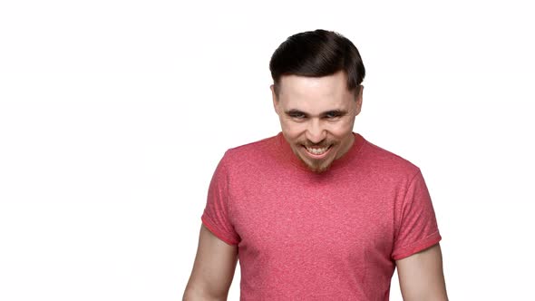 Portrait of Crazy Man 30s Grinning with Mad Gaze and Looking Scary Isolated Over White Background