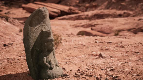 Ancient Statue on the Rocks Desert