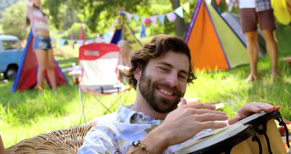 Hipster man playing a musical instrument