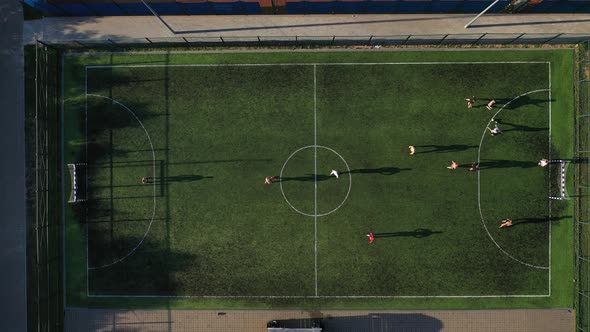 Top View of a Sports Soccer Field with People Playing Soccer.a Small Football Field on the Street in