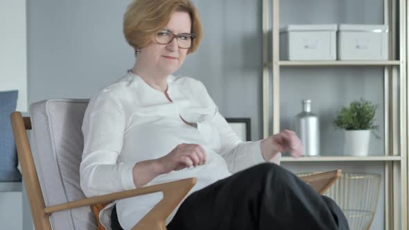 Old Senior Woman Leaving Room While Sitting on Couch