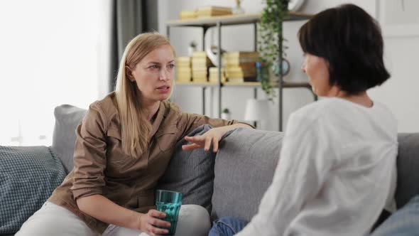 Business Women Talking on Couch