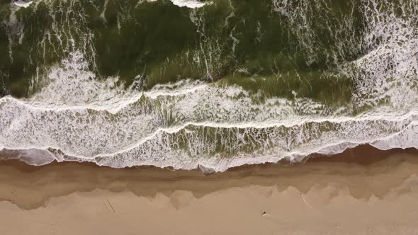 Aerial View of Sandy Beach and Sea Waves