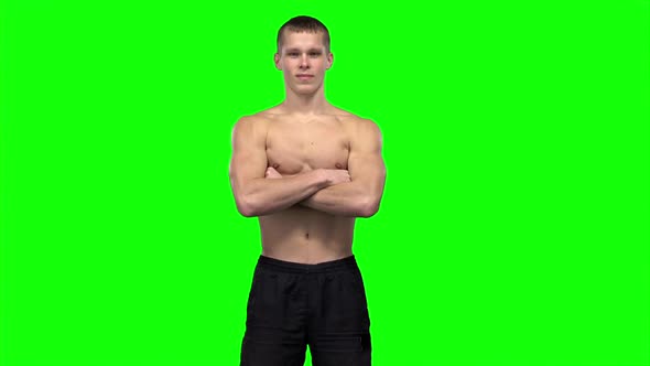 Man Shows Different Muscle Groups. Green Screen