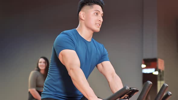 People Cycling at Gym