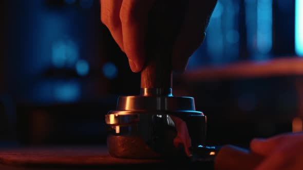 Slow Motion Tamping Fresh Coffee with Neon Light
