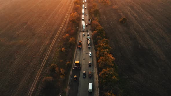 Aerial View of Road Being Resurfaced at Sunset